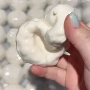 Close-up of glossy white squishy ball