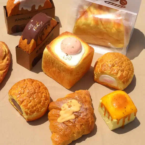 A soft, bread-shaped squishy toy in a realistic loaf design, perfect for sensory play and stress relief.