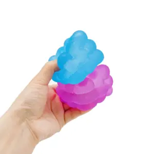 Glossy beaded surface of a cube-like squeeze ball fidget toy