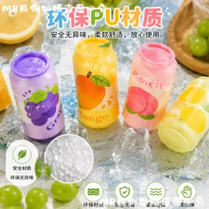Hand squeezing a soft can-shaped squishy toy with water droplets and ice cube props
