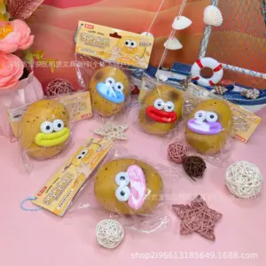 Rounded bumpy potato character toy with pink lips and black pupils
