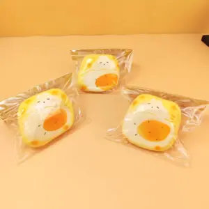 Yellow display box containing several packaged toast bread squishy toys
