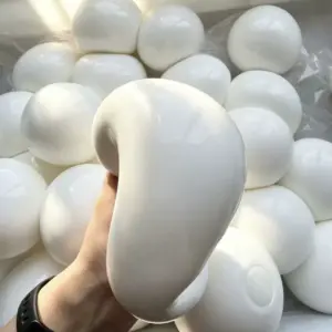 Multiple identical white spheres in a clear bag for bulk display