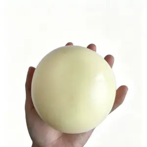 Plain white spherical toys with smooth unmarked surface