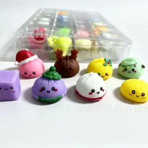 Advent calendar tray with some plain dumpling faces and others with accessories