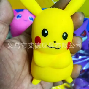 White rounded figure with yellow cheek patches and black smile