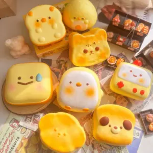 Assortment of bread and cheese squishy toys in various animal shapes